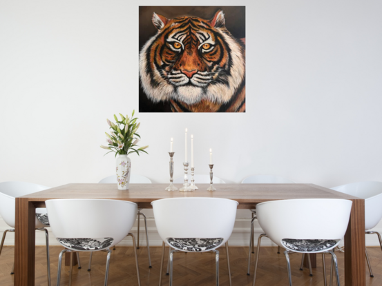 Painted in rich hues this artwork captures the intense gaze of a tiger. This artwork is  unframed 