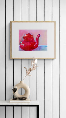 artwork showing a gleaming red tea pot