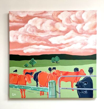 orange cows under pink skies