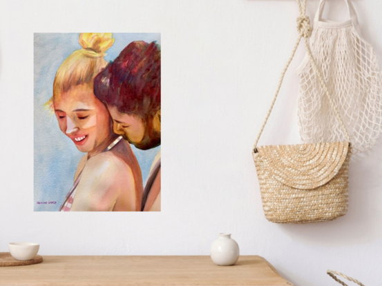  artwork showing a couple sharing a tender embrace on the beach