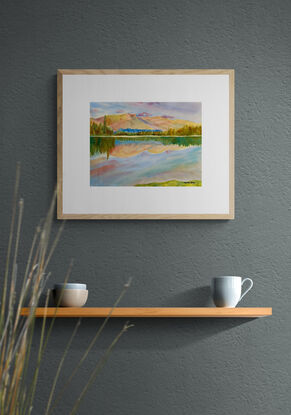 artwork showing a sunny day landscape vista with distant fells and a mirror lake reflection
