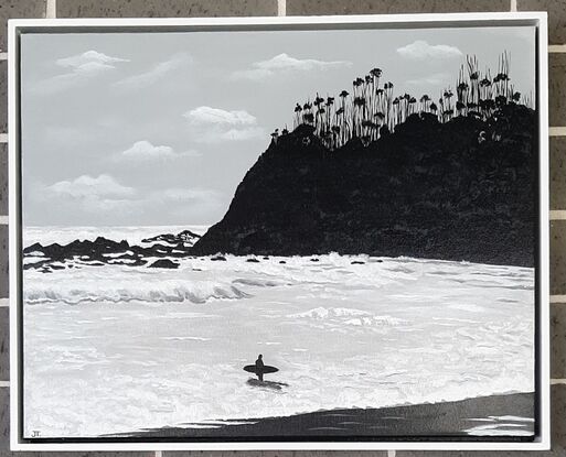 White waves, silver water, black Mountain and a line surfer