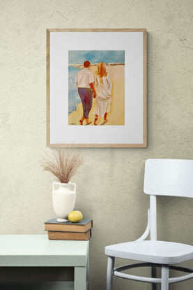 artwork showing a couple walking on the beach

