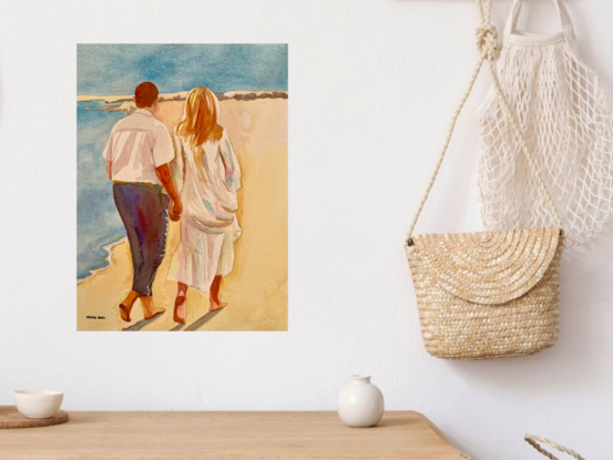 artwork showing a couple walking on the beach

