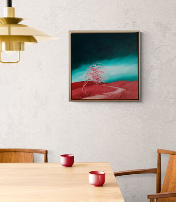 Australian landcape with vibrant grren windswept sky and red/pink hills and tree in the foreground, framed