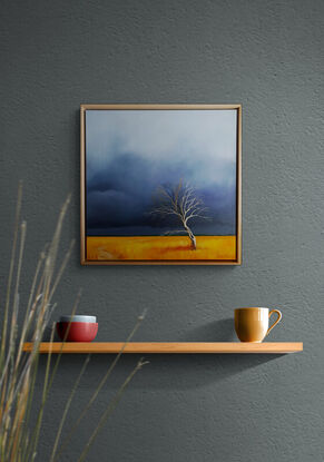 Australian landcape with vibrant gold grasses and a deep blue sky plus a tree and a small path