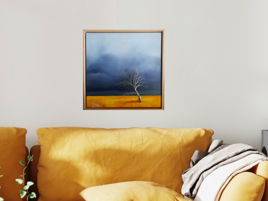 Australian landcape with vibrant gold grasses and a deep blue sky plus a tree and a small path