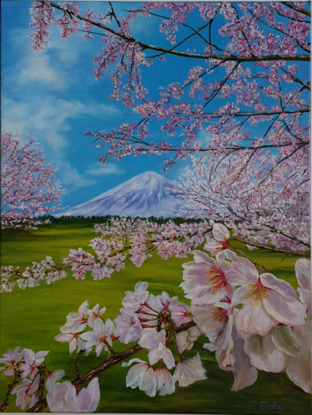 Blossoming Sakura branches and a volcano in the background, Japan. 