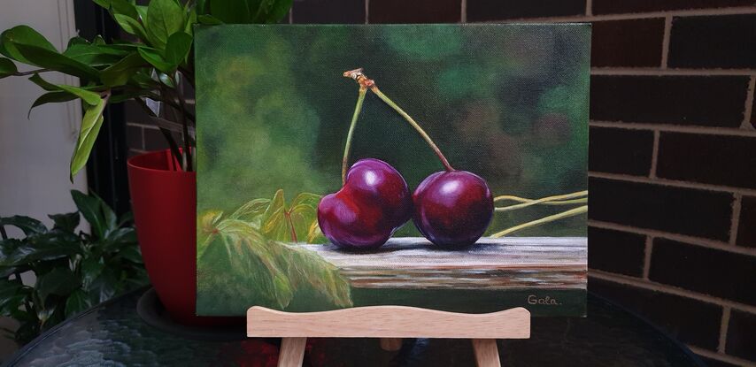 Cherries on the wooden bench 