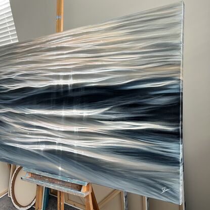 Large realistic painting of ocean waves at sunset