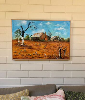 This acrylic framed painting features the rich ochre colours, and clear blue skies of the harsh Australian summer, only a few Emus and Cockatoos remain to survive  the sunburnt land