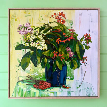 A framed, expressive still life painting of entangled flora in greens, yellows, reds and oranges.