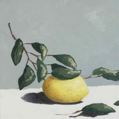 A lemon on a branch with leaves painted with subtle texture on a cream base and a blue grey background