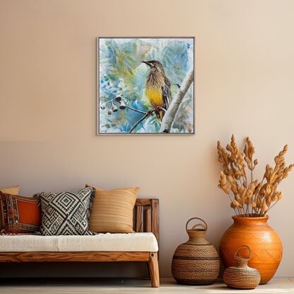 a wattle bird sits on a tree branch