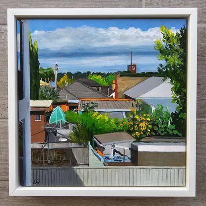 Window view of house roofs and gardens in Inner West Sydney