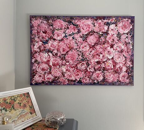 Purple textured background, with deep pink roses covering the canvas. The artwork has been created using a pallet knife, giving a depth to the roses.