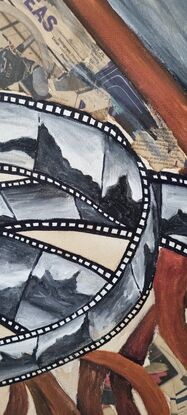 Old film reel with slides weaved through it. The coffee stained background is a nod to artwork you did as a kid at school to help with the vintage feel.