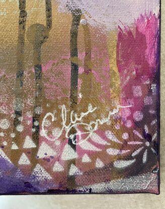 An image of a canvas full of dark hues of purple and navy with hints of magenta acrylic, covered in gold spray paint mixed with water