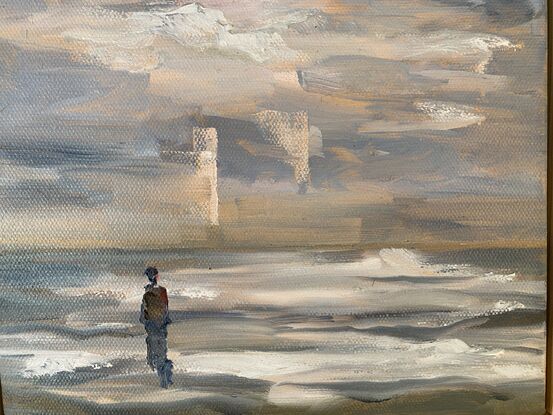 A person gazing out to sea on a winters day