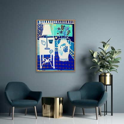 White table, vase and lamp sit against a blue tiled floor and window background.