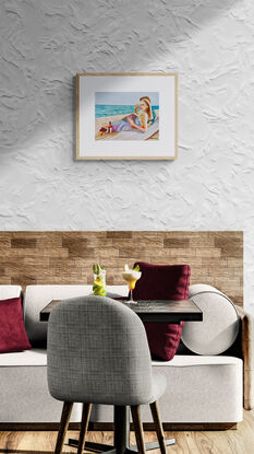 artwork which is the image of a couple sitting sipping red wine on the beach