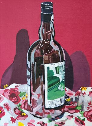 Bottle on floral tablecloth