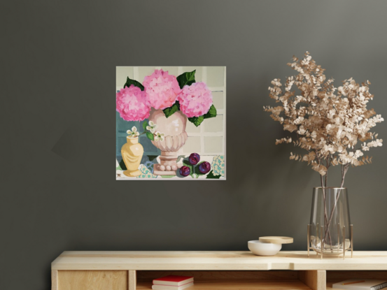 A Serene Still Life of 3 Pink Hydrangeas in a neutral toned terracotta Urn with 3 plums on patterned fabric.