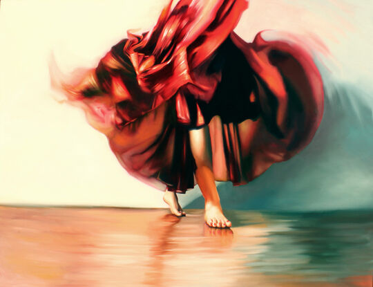 Woman in a red dress dances barefoot