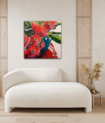 Ficifolia or Flowering Gum tree flowers in a turquoise vase.