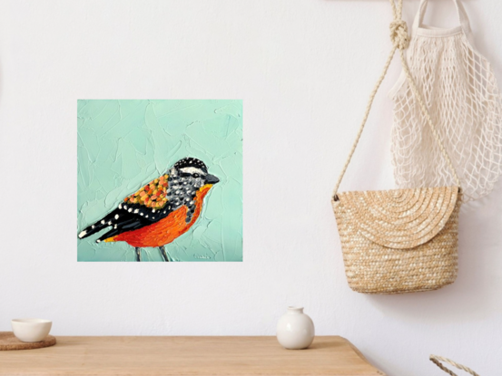 Small painting of an Australian Spotted Pardalote bird painted in textured oil paints.