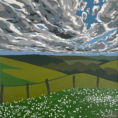 A blue sky with endless clouds above green rolling hills. In the foreground a farmer's fence with little white flowers dotted all over the grass in front of the fence.