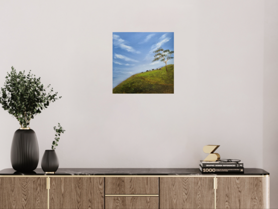 Blue sky with hillside and cows