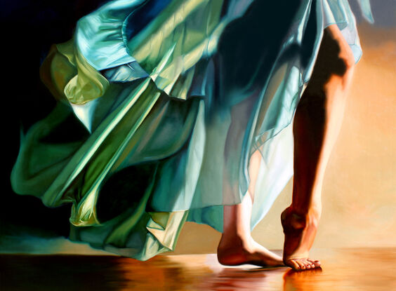 Woman mid-movement dancing barefoot while wearing a Green dress