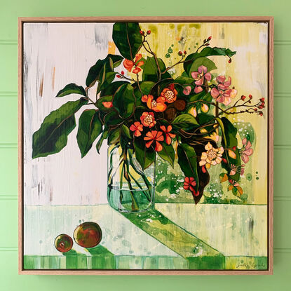 A framed, expressive still life painting of entangled flora in greens, yellows, reds, pinks and oranges.