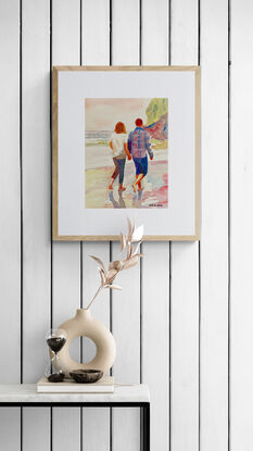 artwork which shows a couple walking companionably across the beach