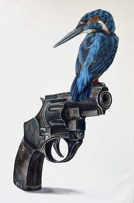 Photo realistic kingfisher bird and revolver on  white background 