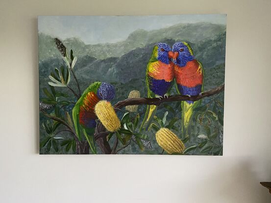 This is a vibrant piece which captures the colours of the Lorikeets. They are offset on a soft background of native  bush. 