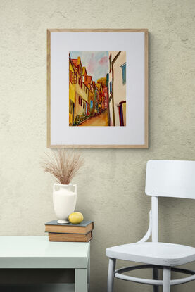 artwork which shows a view of looking up through a narrow steep village street

