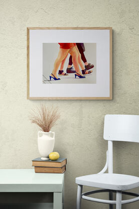 artwork which is the image of three women's legs and fashionable shoes as they walk along
