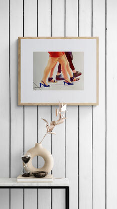 artwork which is the image of three women's legs and fashionable shoes as they walk along
