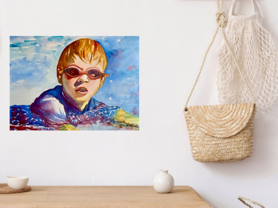 artwork which is the image of a boy swimming wearing goggles 
