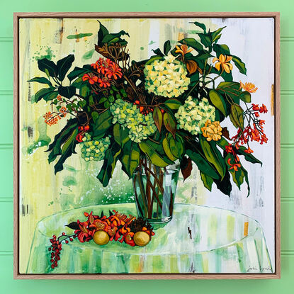 A framed, expressive still life painting of entangled flora in greens, yellows, reds, pinks and oranges.