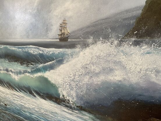 Ocean waves crashing to rocky shore and Sailing Ship