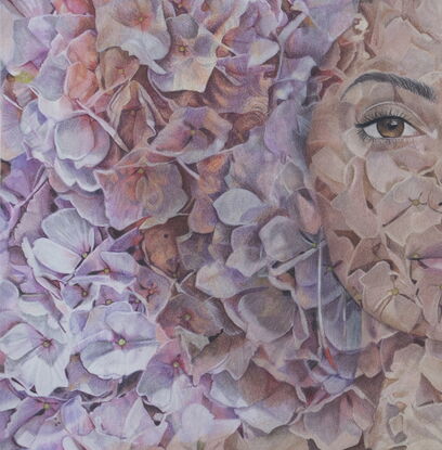 Portrait of a beautiful mixed race woman created by an abundance of hydrangea blooms.