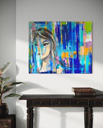 Bold Blue and multi coloured lines with female face.