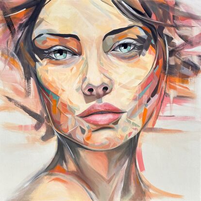 Close up of a beautiful woman’s face with shards of blue, orange and pink tones making up the skin tones in abstract form.