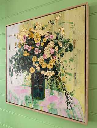 A framed, expressive still life painting of entangled flora in greens, yellows, pinks and whites.