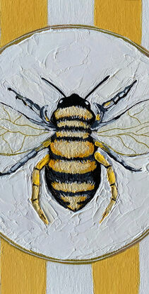 Just a bee on a plate with yellow and white striped background with lots of texture