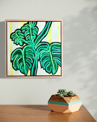 Abstract painting of monstera plant in green with yellow background.