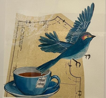 Bird flying away from a cup of twinings peppermint tea with a bodice in the background and stencil doily